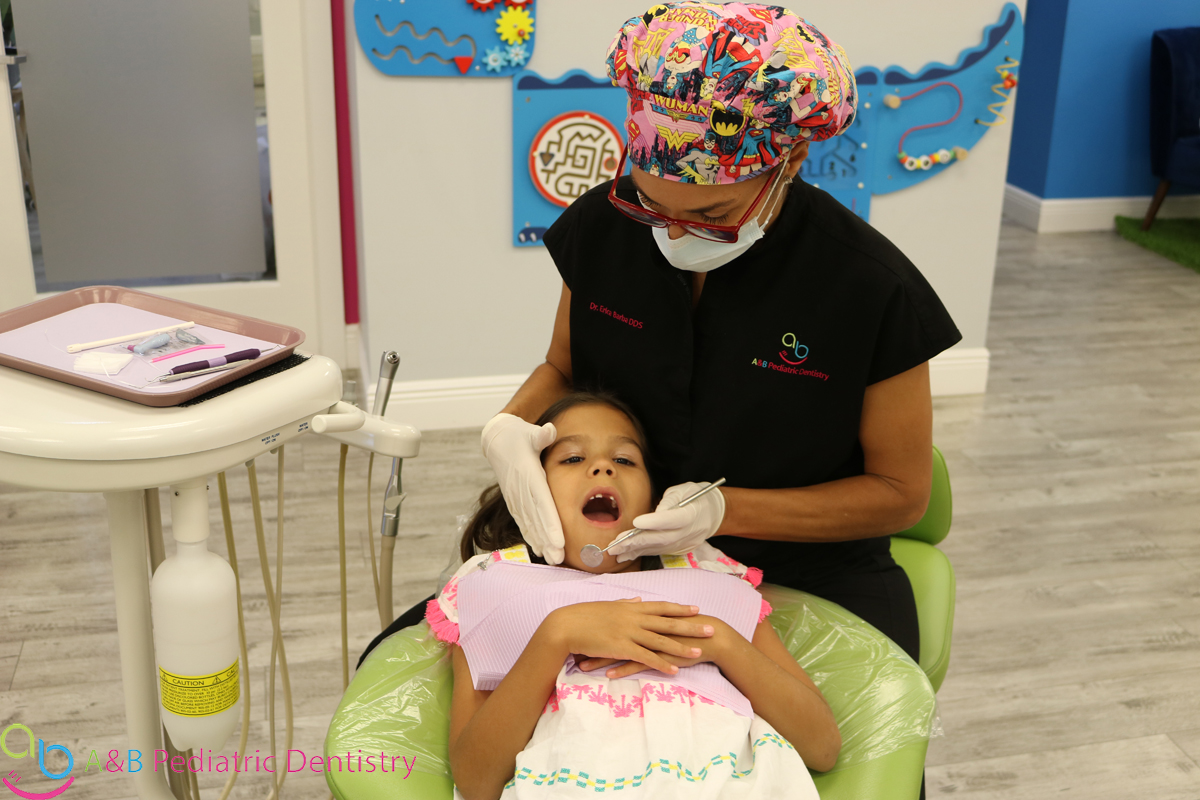 young child getting ready for teeth cleaning ab pediatric