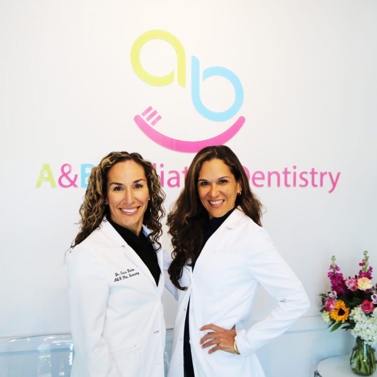 Dr A & Dr B smiling ab pediatric dentistry